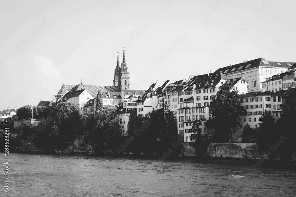 Naklejka premium View on Basel city and river Rhine, Switzerland. People swim in water