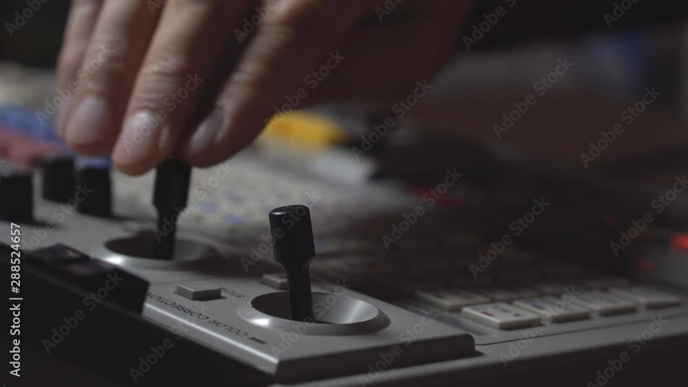 Broadcast Tv Studio Production - Vision Switcher Studio Director broadcast video mixer operation - Close-up of hand Broadcast Tv Studio Production - Vision Switcher Studio Director broadcast video mixer operation - Close-up of hand