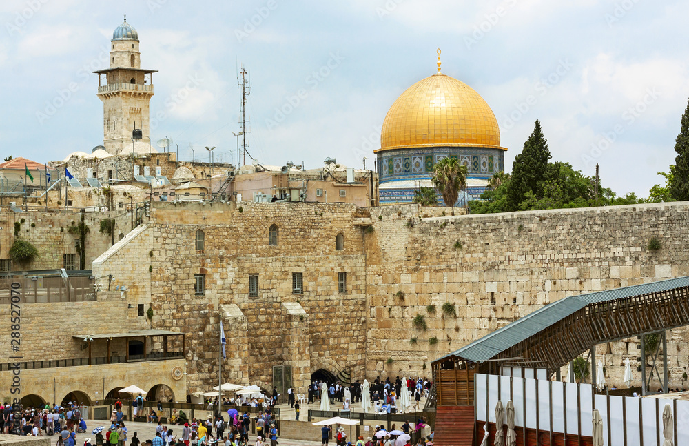 The wailing wall in Jerusalem Israel with the Dome of the rock in the background. The wailing wall is the wester wall of what was the temple mount for the Jews.