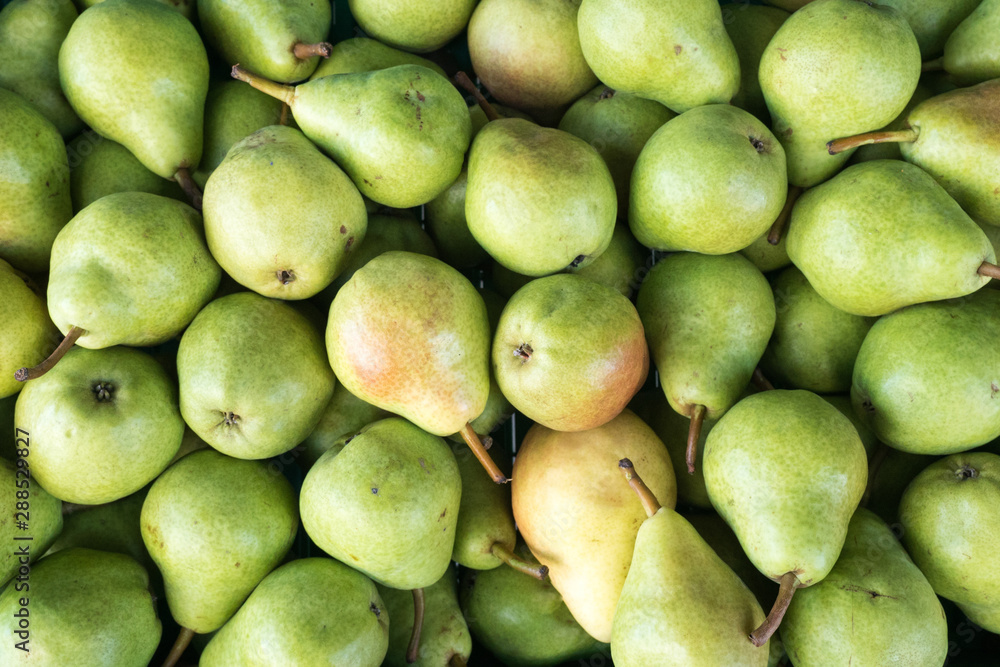 horizontal close up of a crate of organic golden and green pears horizontal close up of a crate of organic golden and green pears