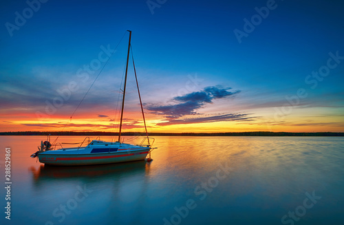 Beautiful summer sunset over water © Piotr Krzeslak