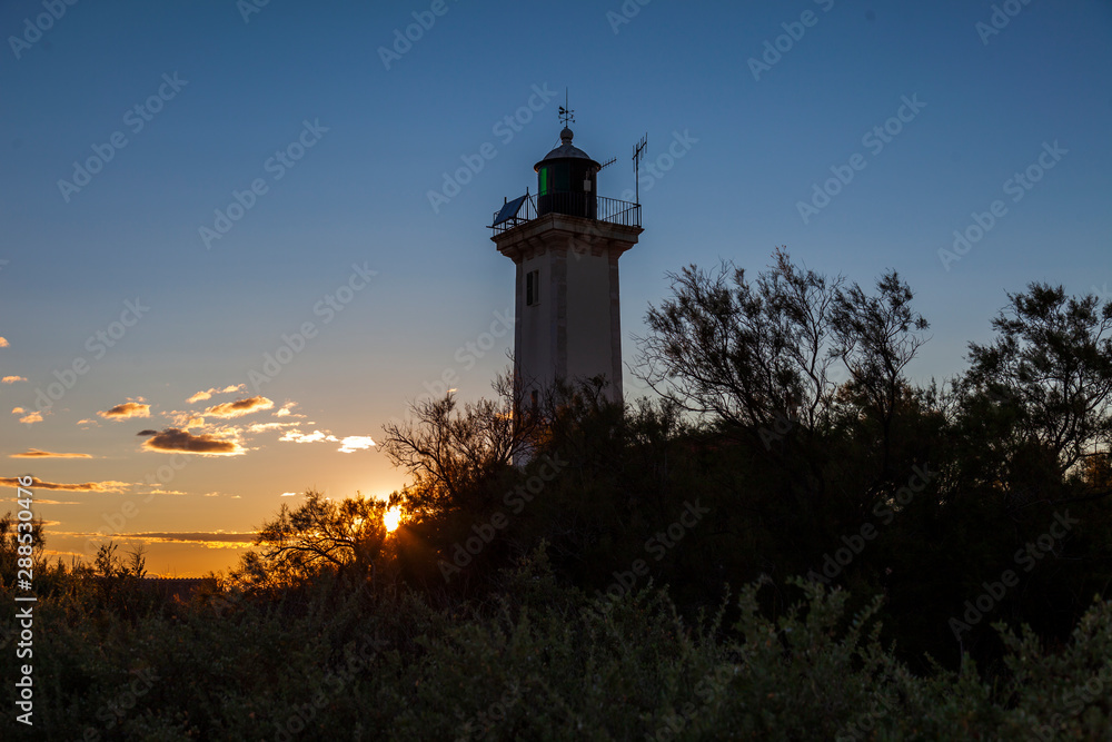 lighthouse at sunset La Gacholle. La Camargue, France. 