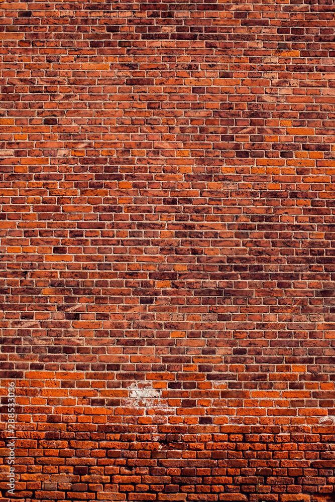 Naklejka premium Red bricks wall background. Old building surface