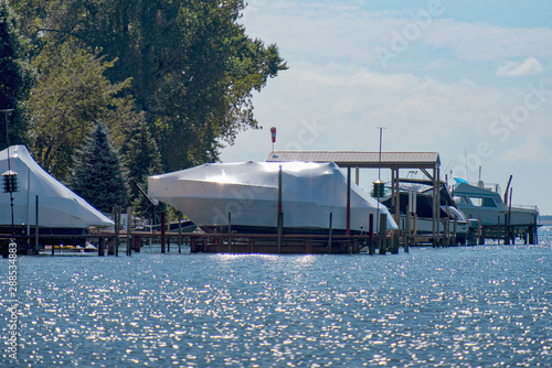 Yachts shrink wrapped for the winter along the river