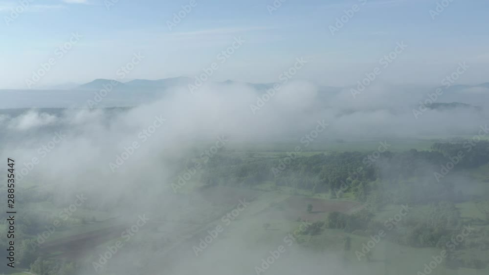 Morning mist over the green valley 4K aerial video Morning mist over the green valley 4K aerial video