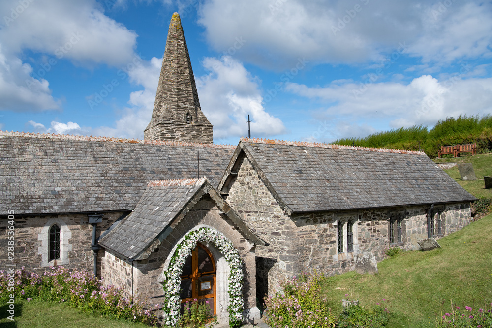 Late norman English church with flower arch for wedding Late norman English church with flower arch for wedding