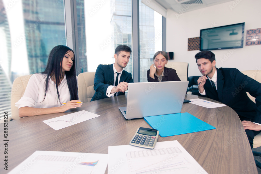 Business people working together at a meeting Business people working together at a meeting