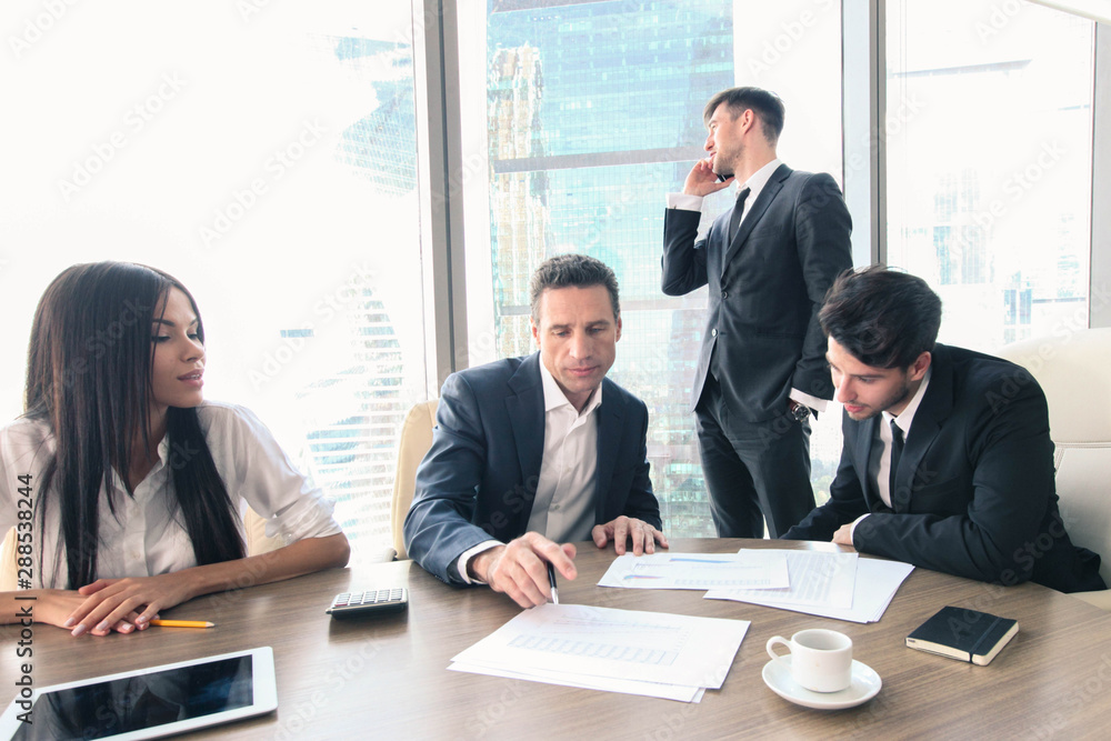 Business people working together at a meeting Business people working together at a meeting