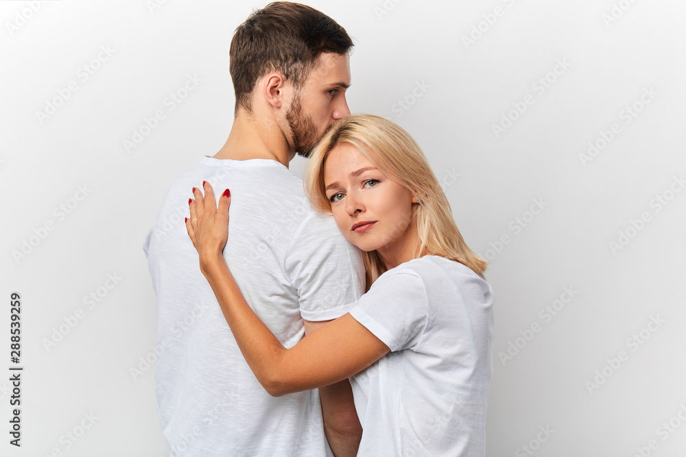 emotional young woman taking leave of her boyfriend, friendship. wife supports her husband he has problems in business emotional young woman taking leave of her boyfriend, friendship. wife supports her husband he has problems in business