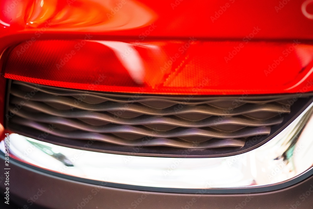 abstract blurred Close up Color detail on the Rear front light of a car