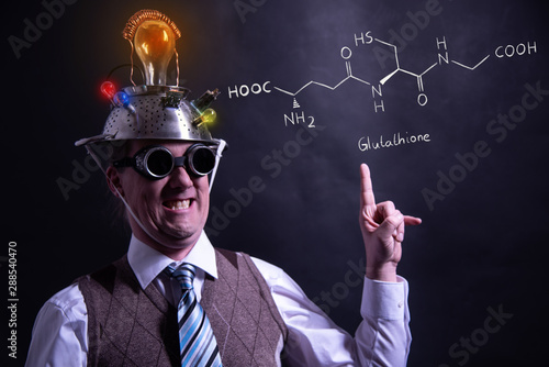 Nerd presenting handdrawn chemical formula of formic Glutathione antioxidant peptide