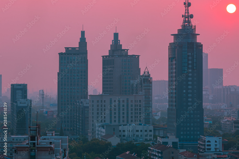 pink sunset over the city in china
