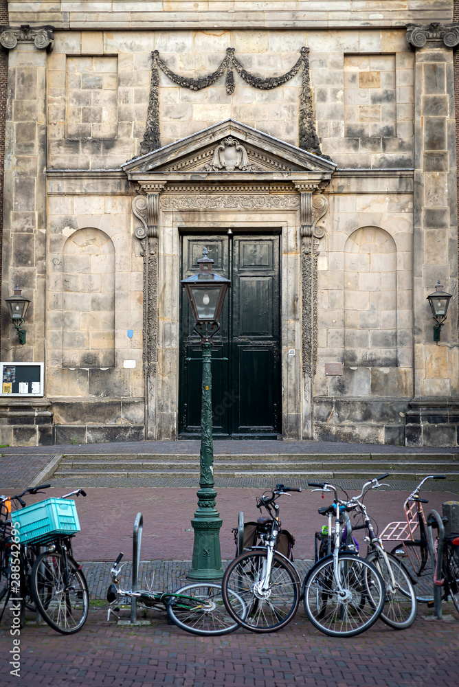 Lamppost, bicycles  and green doors of Marekerk, Leiden, Netherlands