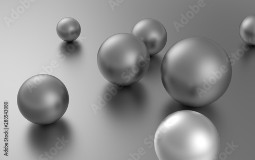 silver balls randomly scattered on the surface of a sphere of different sizes.