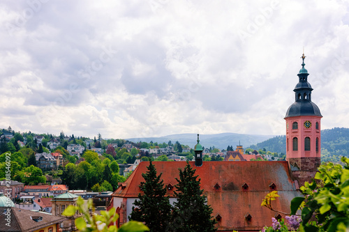 Stiftskirche Collegiate church and cityscape with Black forest in Old city of Baden Baden in Baden Wurttemberg region in Germany. Panoramic view of Bath and spa German town in Europe. Landmark