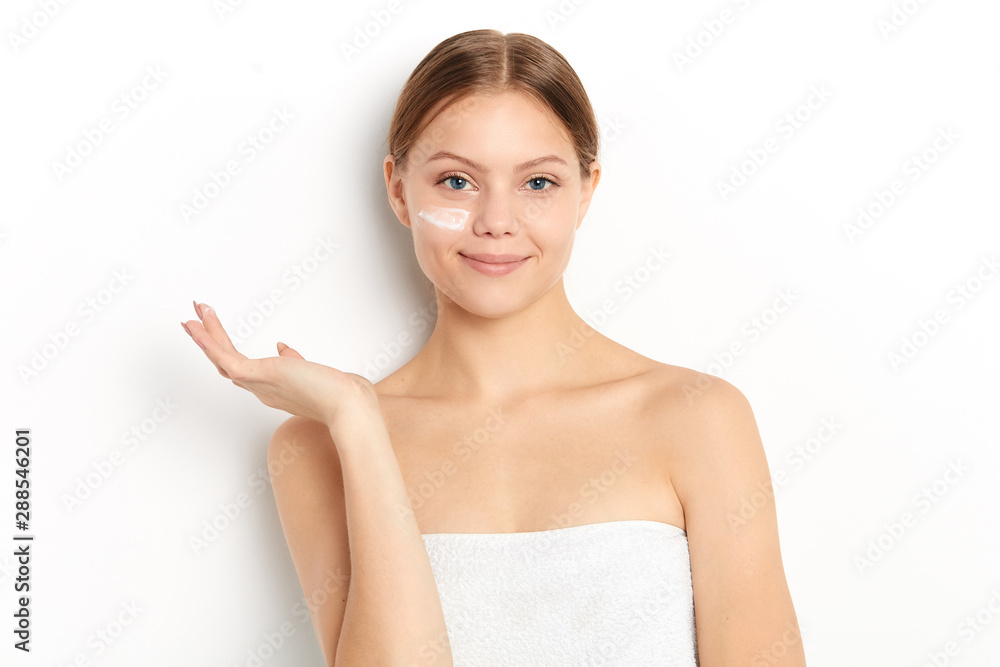 smiling girl holding copy space with a palm, close up portrait, isolated white background, studio shot. advert, secret of beauty smiling girl holding copy space with a palm, close up portrait, isolated white background, studio shot. advert, secret of beauty