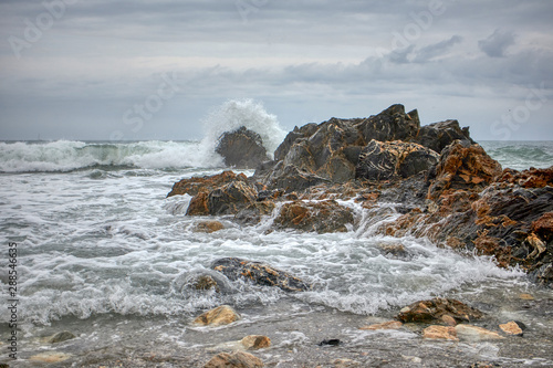  Waves crashing against the rocks by the beach