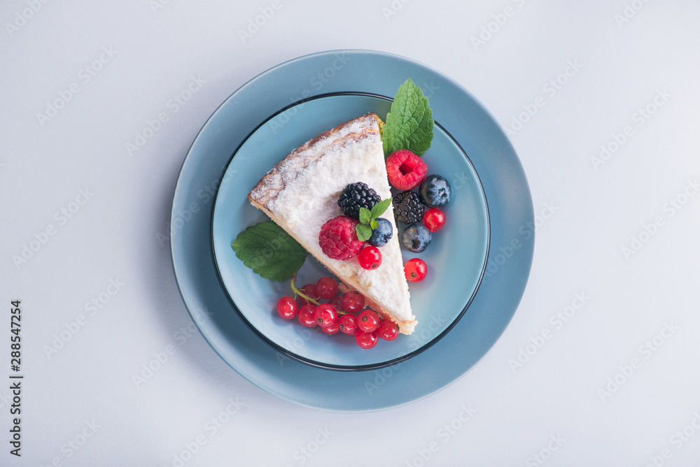 Sweet dessert cake with fresh blackberry, raspberry, currants and blueberry Sweet dessert cake with fresh blackberry, raspberry, currants and blueberry