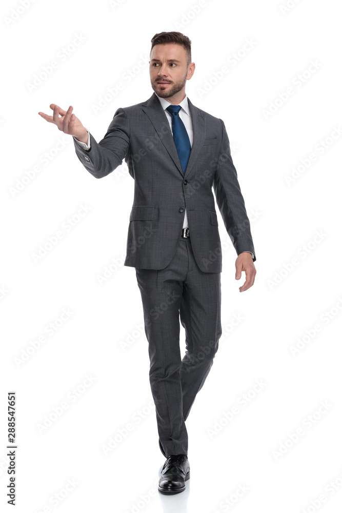 walking young businessman recommending something walking young businessman recommending something