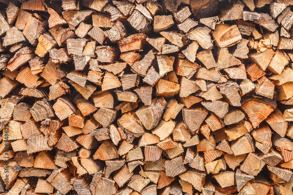 Woodpile. Background of stacked chopped logs. Heap firewood. Selective focus Woodpile. Background of stacked chopped logs. Heap firewood. Selective focus