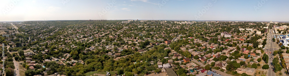 Provincial city in southern Russia on a summer sunny day - small houses, lots of green drone view, aerial view 