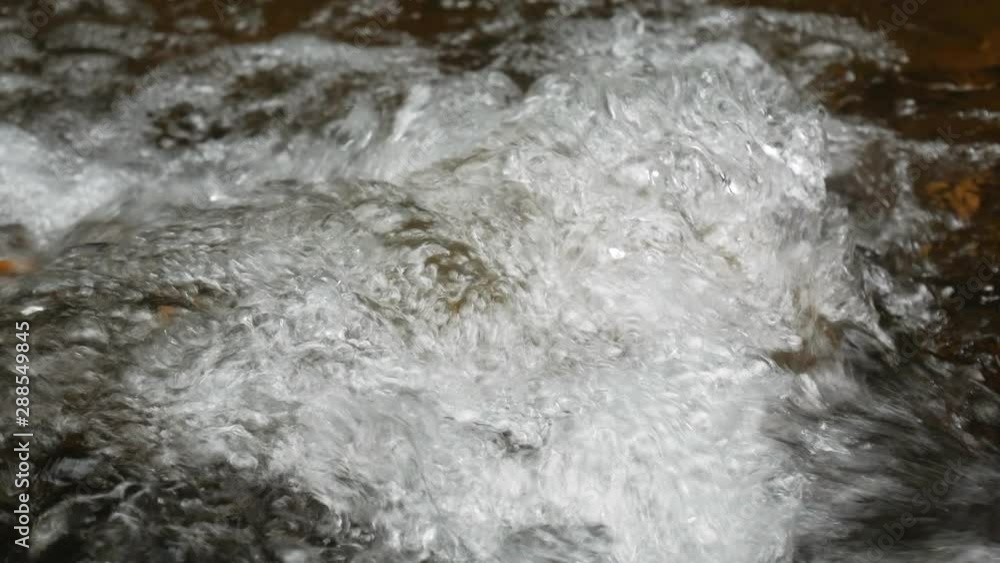 Beautiful mountain river flowing stones in the nature forest. Beautiful mountain river flowing stones in the nature forest.