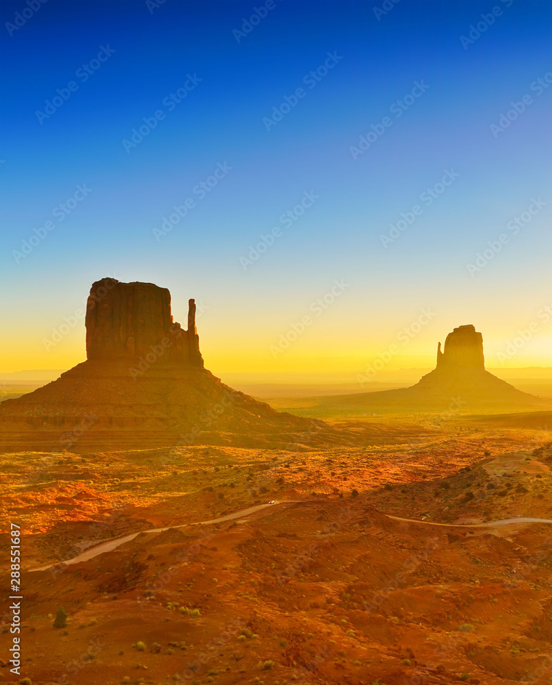 View of Monument Valley at sunrise near the border of Arizona and Utah in Navajo Nation Reservation in USA.