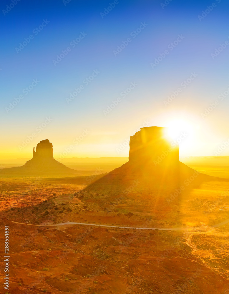 View of Monument Valley at sunrise near the border of Arizona and Utah in Navajo Nation Reservation in USA.