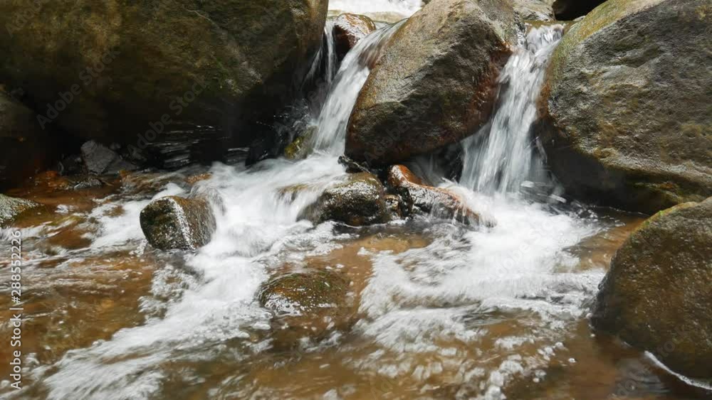 Beautiful mountain river flowing stones in the nature forest. Beautiful mountain river flowing stones in the nature forest.