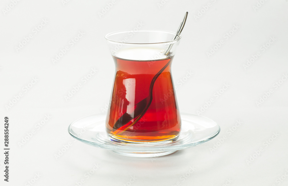 Glass Turkish brewed black tea isolated on white background. Turkish traditional hot drink Glass Turkish brewed black tea isolated on white background. Turkish traditional hot drink
