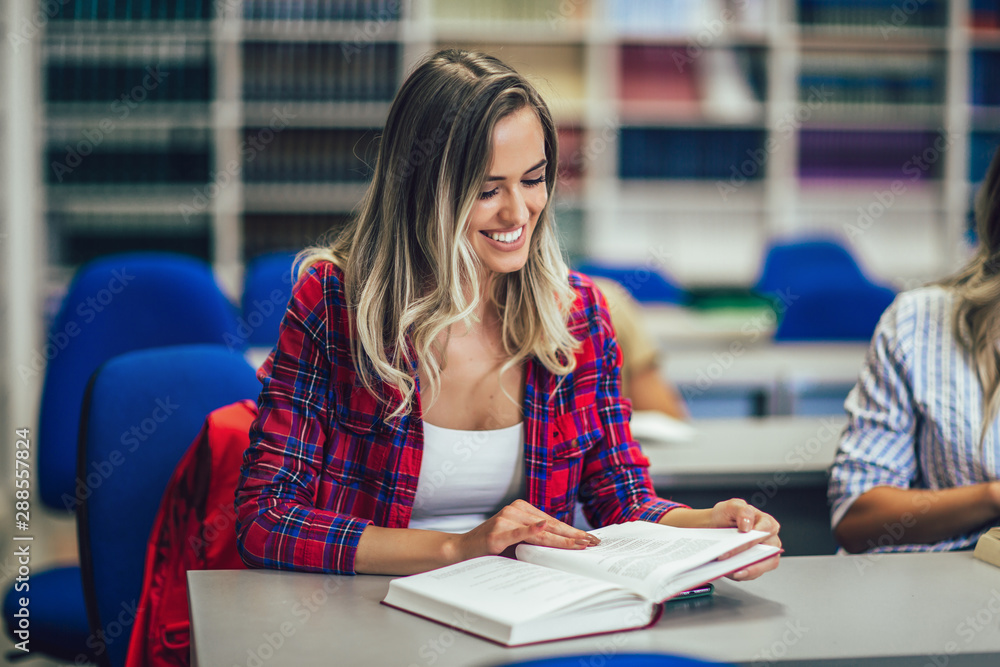 Portrait of a beautiful student in a library Portrait of a beautiful student in a library