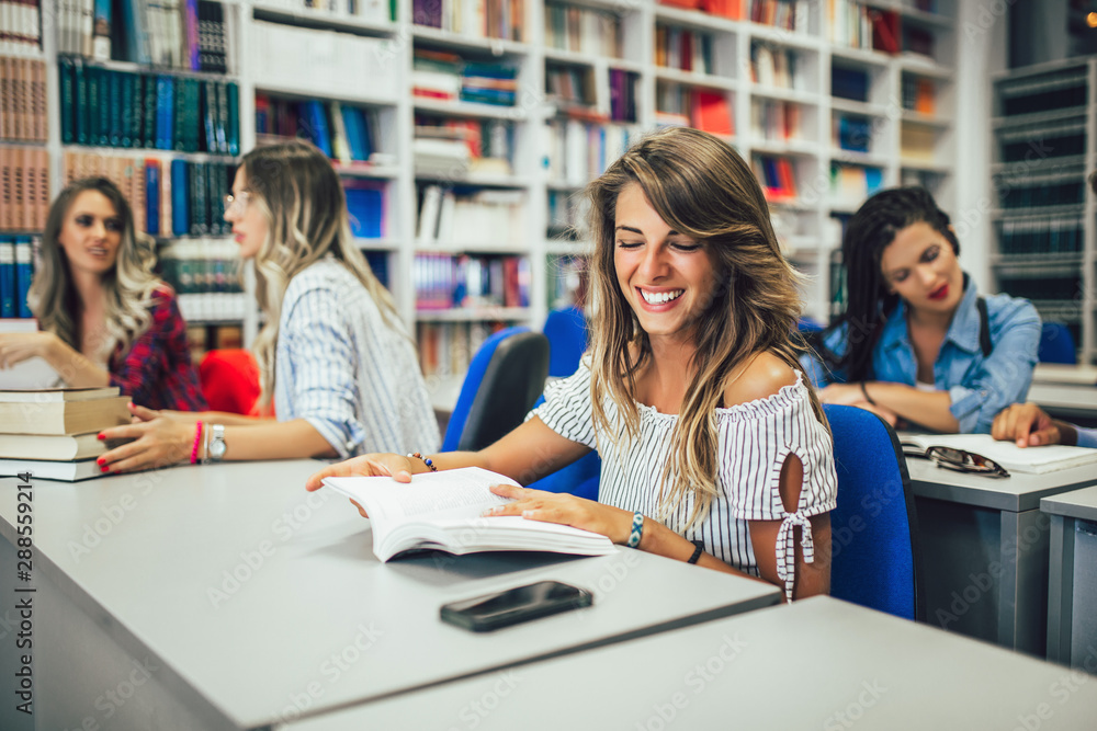 Portrait of a beautiful student in a library Portrait of a beautiful student in a library