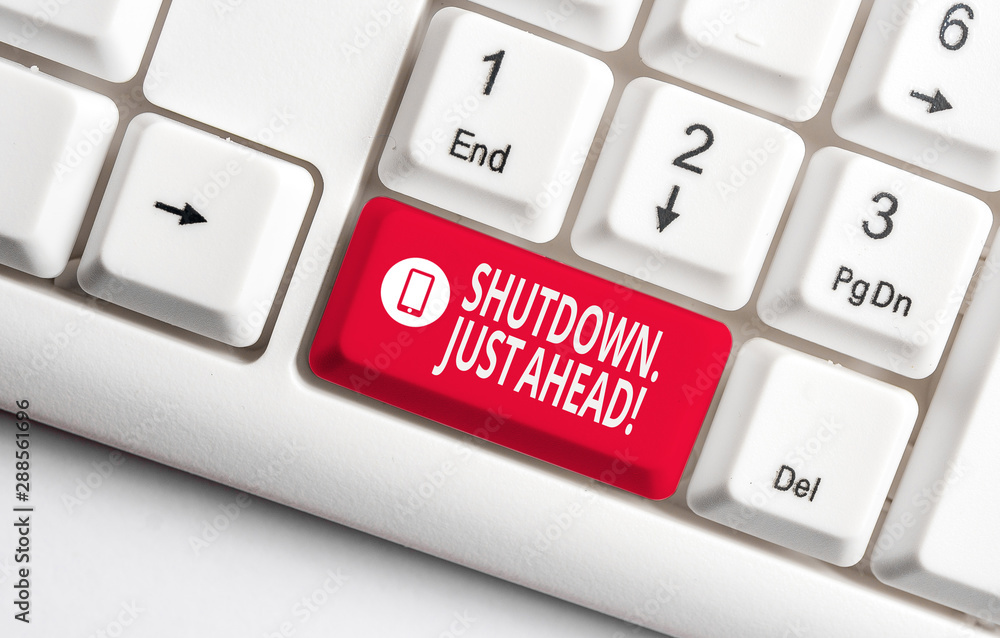 Text sign showing Shutdown Just Ahead. Business photo text closing factory business either short time or forever White pc keyboard with empty note paper above white background key copy space Text sign showing Shutdown Just Ahead. Business photo text closing factory business either short time or forever White pc keyboard with empty note paper above white background key copy space