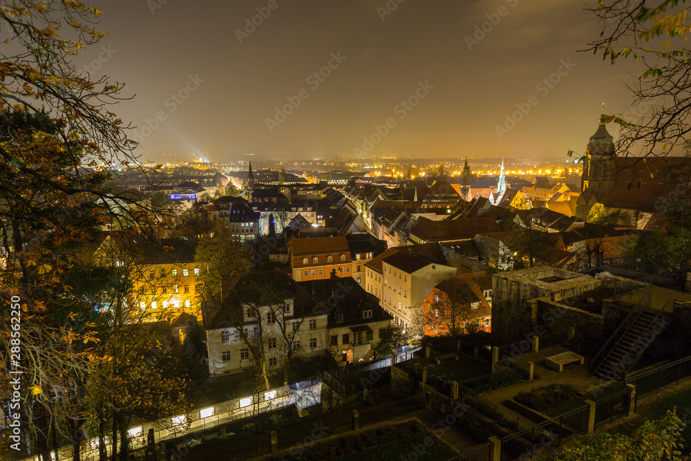 illuminated city view from castle of Pirna at Night, shrouded in Fog, Saxony
