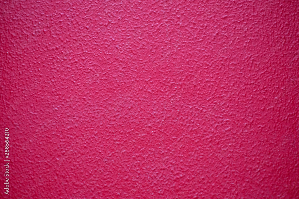 Fototapeta premium Bright bold pink textured surface.