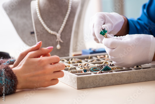 Young jeweler working in his workshop photo