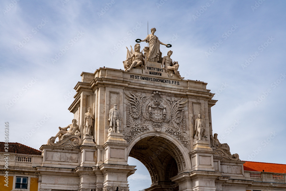 Fototapeta premium Ornate palace entrance to the city in Praca do Comercio or Terreiro do Paco in downtown Lisbon