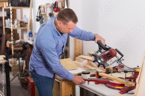 Carpenter working with table saw