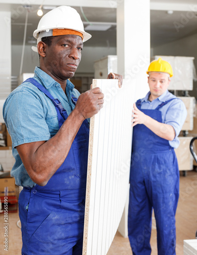 Men contractors working indoors