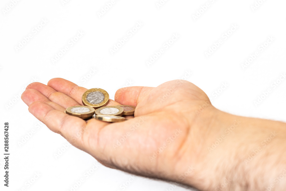 Holding one pound in hand Holding one pound in hand