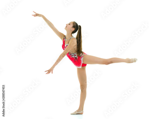 The gymnast perform an acrobatic element.