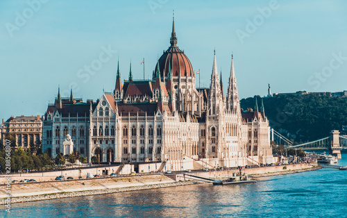 Famous Parliament building on the Danuve river in Budapest, hungary. Tourist attraction and travel destination. Gothic style. Side top view on the sunny day. Clear sky photo
