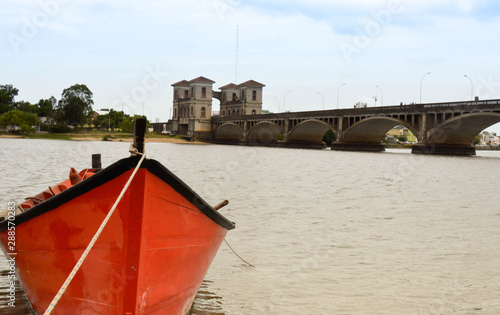 barco e ponte, cidade de jaguarão, fronteira de uruguay e brasil.  photo