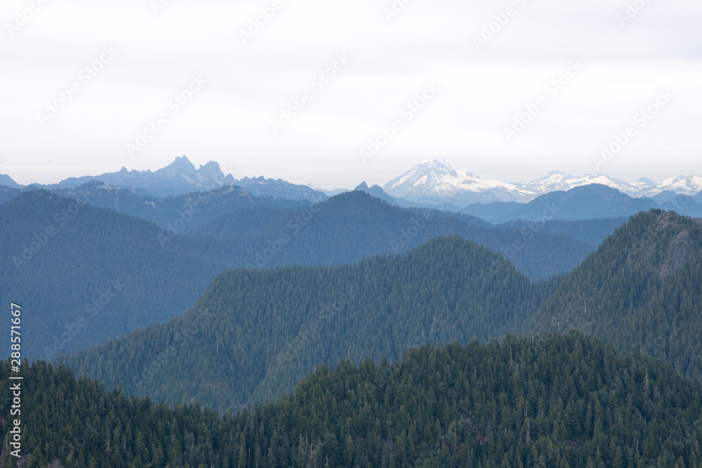 scenic panorama over the mountains of North Vancouver in summer, snow peaks, Canada, BC