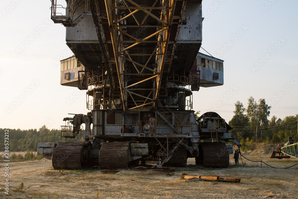 multi-bucket excavator giant at limestone quarry in summer day multi-bucket excavator giant at limestone quarry in summer day