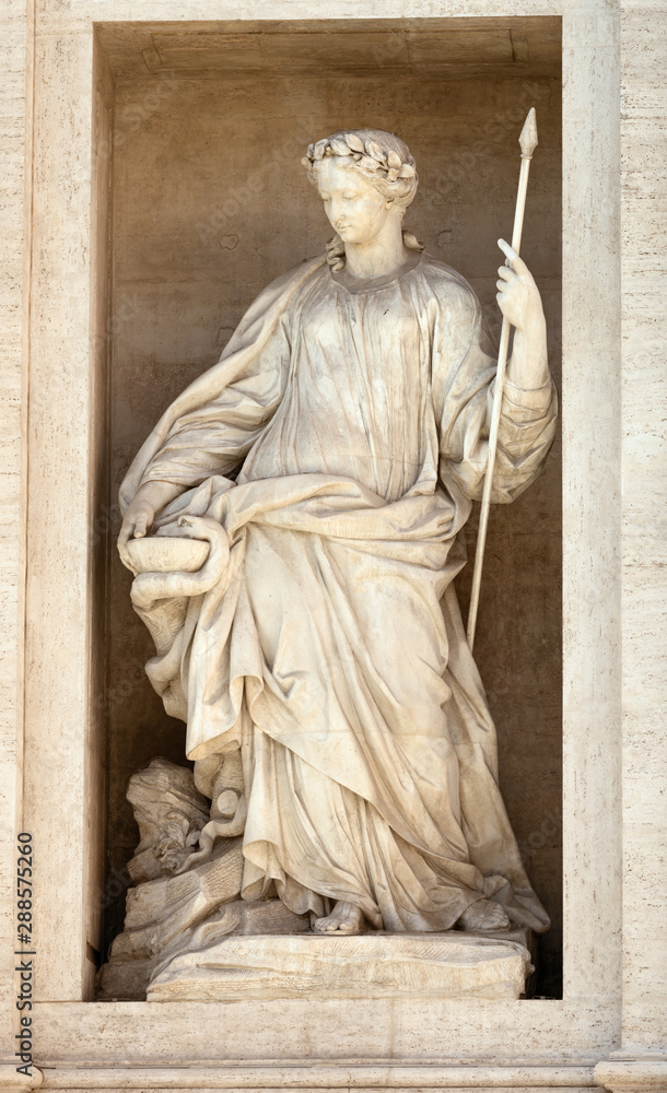 Statue of Health. Detail of the Trevi fountain in Rome, Italy