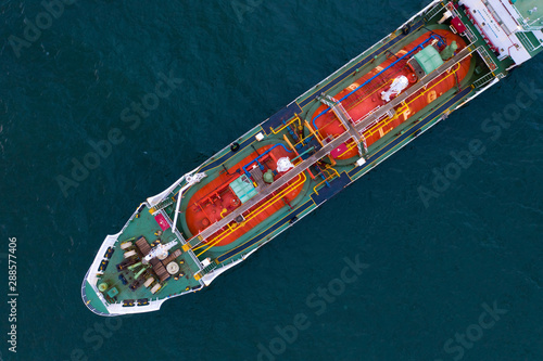 Aerial view of gas storage tank on ship in port, Refinery Industry and export cargo ship