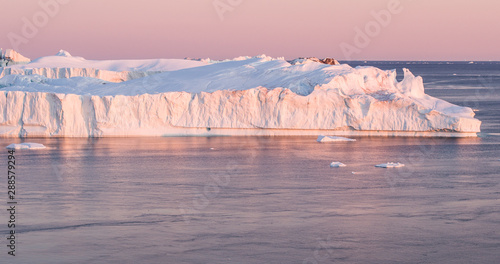 Wallpaper Mural Climate Change and Global Warming - Icebergs from melting glacier in icefjord in Ilulissat, Greenland. Aerial image of arctic nature ice landscape. Unesco World Heritage Site. Torontodigital.ca
