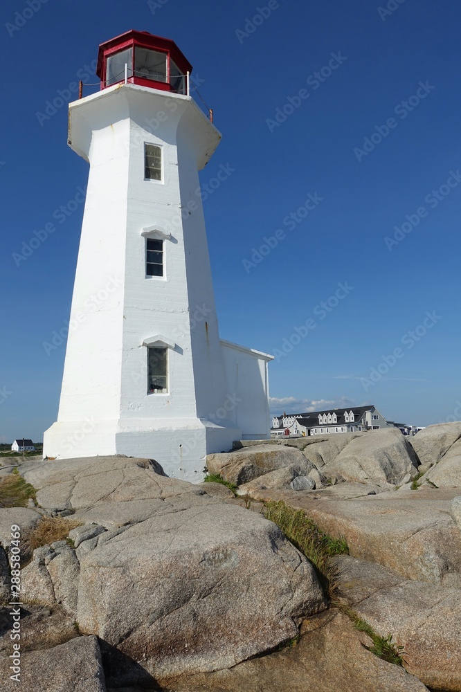 View of the Peggy’s Point lighthouse, located in Peggy’s Cove outside of Halifax, capital of the Canadian province of Nova Scotia, in St Margaret’s Bay