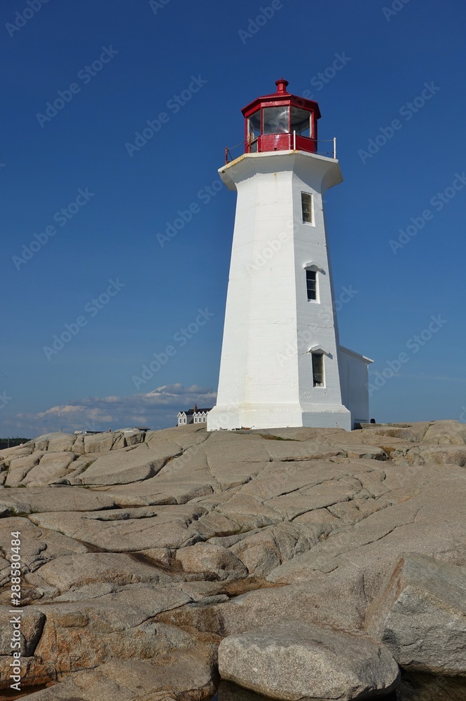 View of the Peggy’s Point lighthouse, located in Peggy’s Cove outside of Halifax, capital of the Canadian province of Nova Scotia, in St Margaret’s Bay